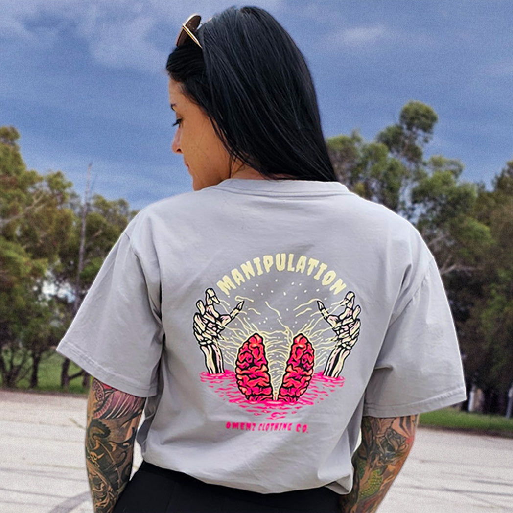 Women’s alternative graphic tees by Omenz – relaxed and cropped fits with tattoo-inspired designs.