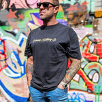 Front shot of the Omenz Clothing Co. Full Throttle oversized unisex faded black tee. Premium 100% cotton alternative streetwear inspired design.
