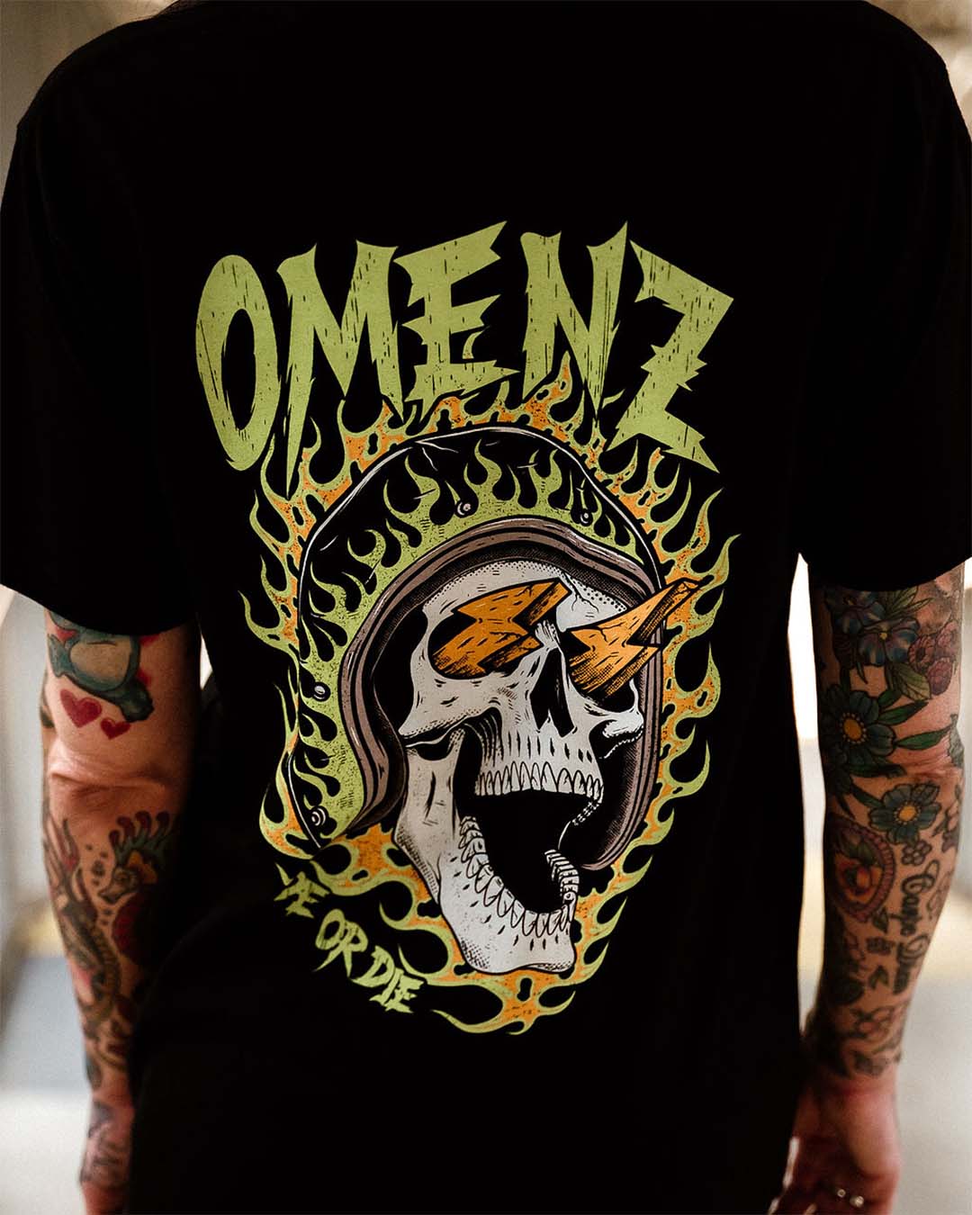 Tattooed female wearing an Omenz Killswitch T-shirt