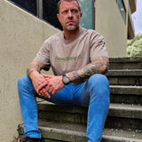 Front image Omenz Alternative Athletic Streetwear Strike Hard Unisex Oversized Tee in 100% premium cotton and a faded khaki.